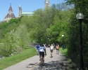 cyclists behind behind Parliament Buildings