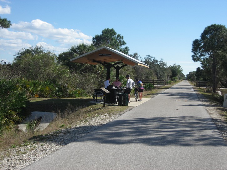 cyclists at rest station on the Legacay Trail.