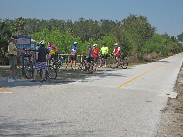 group of cyclists stop for a rest on the Legacy Trail