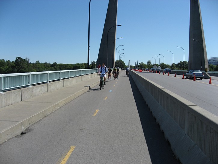 cyclists on bridge to Île Notre-Dame