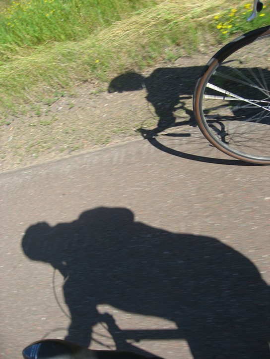 shadows of cyclist on Highway 61