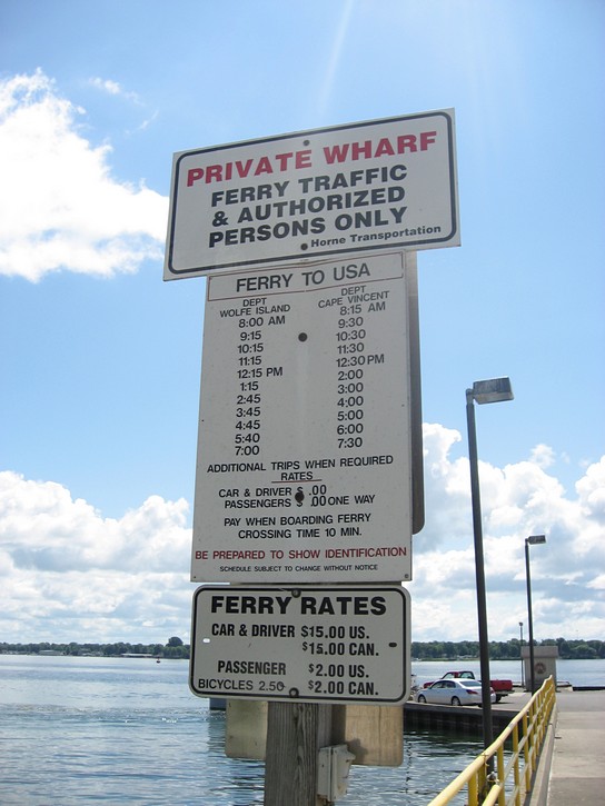 sign with ferry schedule and fees